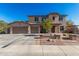 Two-story house with three-car garage and landscaped front yard at 28225 N 65Th Ln, Phoenix, AZ 85083