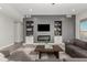 Living room with fireplace and built-in shelving at 28225 N 65Th Ln, Phoenix, AZ 85083