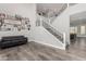 Modern staircase with metal railing and gray walls at 28225 N 65Th Ln, Phoenix, AZ 85083