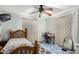 Bedroom with wood bed frame and patterned curtains at 2825 N 33Rd Pl, Phoenix, AZ 85008