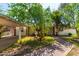 Ranch house with carport, mature trees, and brick walkway at 2825 N 33Rd Pl, Phoenix, AZ 85008