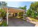 Brick walkway leads to charming ranch home with carport and established landscaping at 2825 N 33Rd Pl, Phoenix, AZ 85008