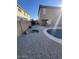 Large backyard with pebble landscaping, fire pit, and kidney-shaped pool at 2826 E Augusta Ave, Chandler, AZ 85249