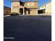 Two-story house with a two-car garage and desert landscaping at 2826 E Augusta Ave, Chandler, AZ 85249