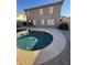 Kidney-shaped pool with surrounding concrete decking and pebble stone at 2826 E Augusta Ave, Chandler, AZ 85249