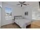 Light and airy bedroom featuring a queen bed, neutral decor, and wood floors at 29798 N 121St Dr, Peoria, AZ 85383