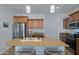 Kitchen island with granite countertop and seating at 29798 N 121St Dr, Peoria, AZ 85383