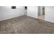 Large bedroom with carpet and access to bathroom and closet at 30734 W Clarendon Ave, Buckeye, AZ 85396