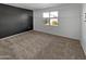 Spacious bedroom with neutral wall paint and carpeting at 30734 W Clarendon Ave, Buckeye, AZ 85396