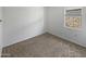 Simple bedroom with carpeted floor and window at 30734 W Clarendon Ave, Buckeye, AZ 85396