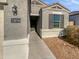 Front entrance of the house with a walkway and landscaping at 30734 W Clarendon Ave, Buckeye, AZ 85396