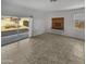 Bright living room with sliding glass doors leading to the backyard at 30734 W Clarendon Ave, Buckeye, AZ 85396