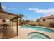 Inviting backyard oasis with a pool, spa, and covered patio at 3247 E Silverwood Dr, Phoenix, AZ 85048