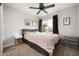 Bedroom with ceiling fan, large window, and ample natural light at 3247 E Silverwood Dr, Phoenix, AZ 85048