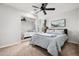 Bright bedroom with mirrored closet doors and ceiling fan at 3247 E Silverwood Dr, Phoenix, AZ 85048