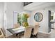 Charming dining area with a rustic table, neutral chairs and a chalkboard wall at 3247 E Silverwood Dr, Phoenix, AZ 85048