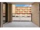 Balcony with tiled floor and view of adjacent buildings at 351 E Thomas Rd # D208, Phoenix, AZ 85012