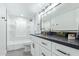 Modern bathroom with white vanity and dark countertop at 351 E Thomas Rd # D208, Phoenix, AZ 85012