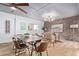 Modern dining area with a long wooden table and leather chairs at 351 E Thomas Rd # D208, Phoenix, AZ 85012