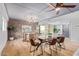 Modern dining area with a long wooden table and leather chairs at 351 E Thomas Rd # D208, Phoenix, AZ 85012