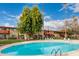 Sparkling blue swimming pool with lounge chairs at 351 E Thomas Rd # D208, Phoenix, AZ 85012