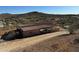 Metal building with covered area, situated on a desert landscape with mountain views at 42213 N 3Rd St, Phoenix, AZ 85086