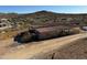 Metal building with covered area, situated on a desert landscape with mountain views at 42213 N 3Rd St, Phoenix, AZ 85086