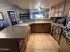 Kitchen with island and ample counter space at 42213 N 3Rd St, Phoenix, AZ 85086