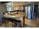 Well-equipped kitchen with stainless steel appliances and a breakfast bar with seating at 42213 N 3Rd St, Phoenix, AZ 85086