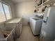 Bright laundry room with washer and dryer at 42213 N 3Rd St, Phoenix, AZ 85086