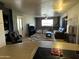 Open concept living room with a wood-burning stove, neutral decor, and ample space at 42213 N 3Rd St, Phoenix, AZ 85086