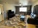 Comfortable living room features plush seating, neutral decor, and a large window at 42213 N 3Rd St, Phoenix, AZ 85086