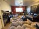 Living room featuring a brown couch and an accent rug at 42213 N 3Rd St, Phoenix, AZ 85086