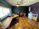 Bright office space featuring hardwood floors, ample natural light, and a custom built-in desk at 42213 N 3Rd St, Phoenix, AZ 85086