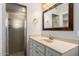 Bathroom featuring a single sink vanity and glass shower at 4525 E Calle Ventura --, Phoenix, AZ 85018