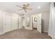 Bedroom featuring gray carpet, neutral walls, and views into other rooms at 4525 E Calle Ventura --, Phoenix, AZ 85018