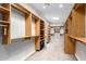 Large walk-in closet with wood shelving and drawers for maximum storage at 4525 E Calle Ventura --, Phoenix, AZ 85018