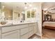 Double vanity bathroom with large mirrors and a walk-in shower at 4547 E Sodalite St, San Tan Valley, AZ 85143