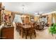 Formal dining room with wood table and chandelier at 4547 E Sodalite St, San Tan Valley, AZ 85143