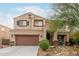 Two-story house with brown accents and landscaped yard at 4547 E Sodalite St, San Tan Valley, AZ 85143