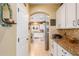 Walk-through kitchen pantry with ample shelving for storage at 4547 E Sodalite St, San Tan Valley, AZ 85143