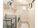 Convenient laundry room with washer, dryer, and shelving at 4547 E Sodalite St, San Tan Valley, AZ 85143