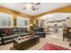 Spacious living room with leather sofas and kitchen view at 4547 E Sodalite St, San Tan Valley, AZ 85143