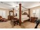 Large main bedroom with a stately four-poster bed at 4547 E Sodalite St, San Tan Valley, AZ 85143