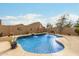 Stunning kidney-shaped pool with water features and a large backyard at 4547 E Sodalite St, San Tan Valley, AZ 85143