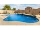 Large kidney-shaped pool with water features and a spacious backyard at 4547 E Sodalite St, San Tan Valley, AZ 85143