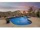 Relaxing kidney-shaped pool with surrounding patio at 4547 E Sodalite St, San Tan Valley, AZ 85143