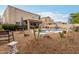 Relaxing backyard with a kidney-shaped pool and desert landscaping at 4547 E Sodalite St, San Tan Valley, AZ 85143