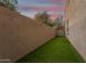 Artificial turf side yard with a block wall at 4547 E Sodalite St, San Tan Valley, AZ 85143