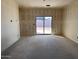 Unfurnished room with sliding door leading to backyard at 47761 W Kenner Dr, Maricopa, AZ 85139